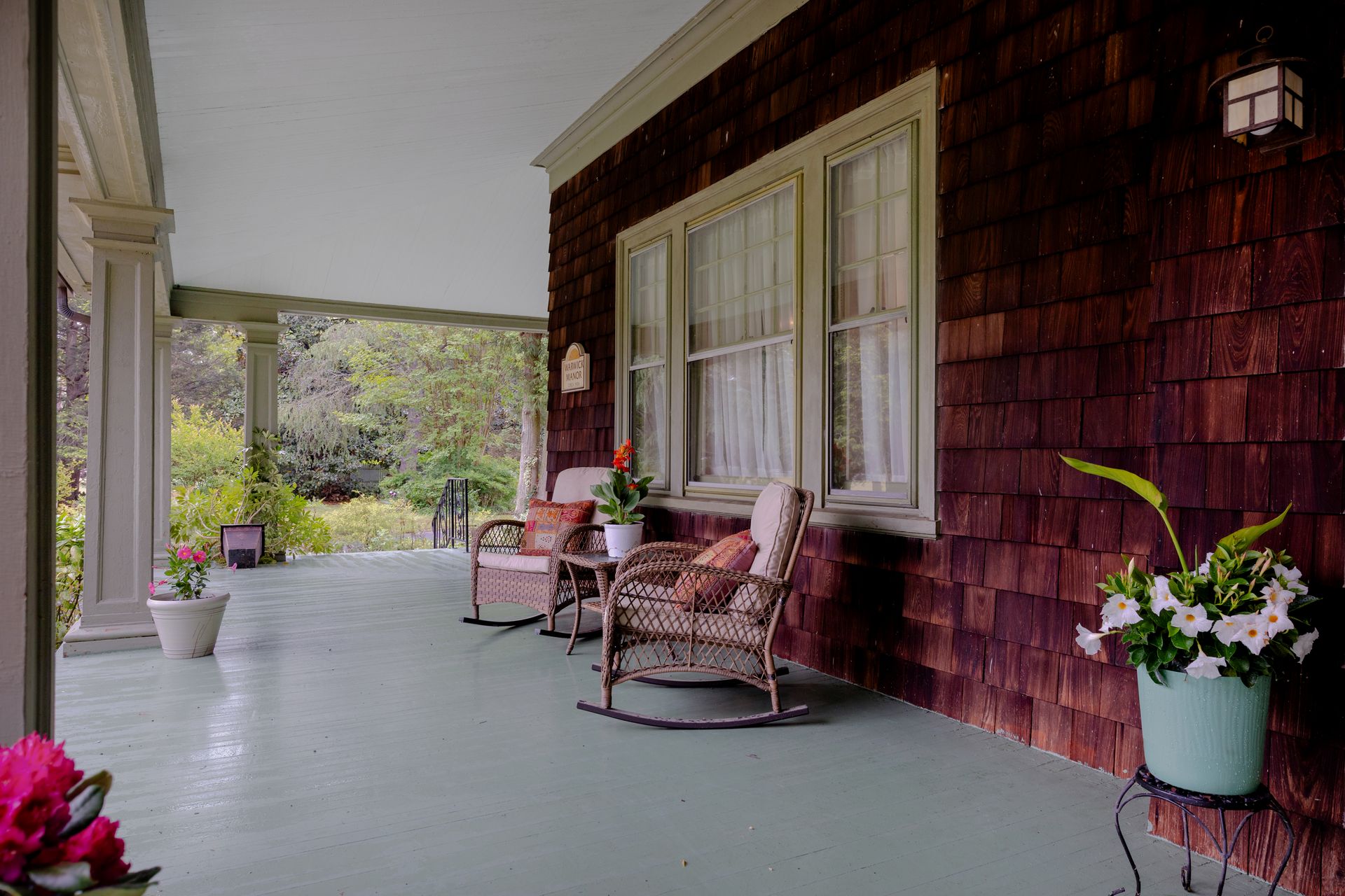 Front porch with wicker rocking chairs
