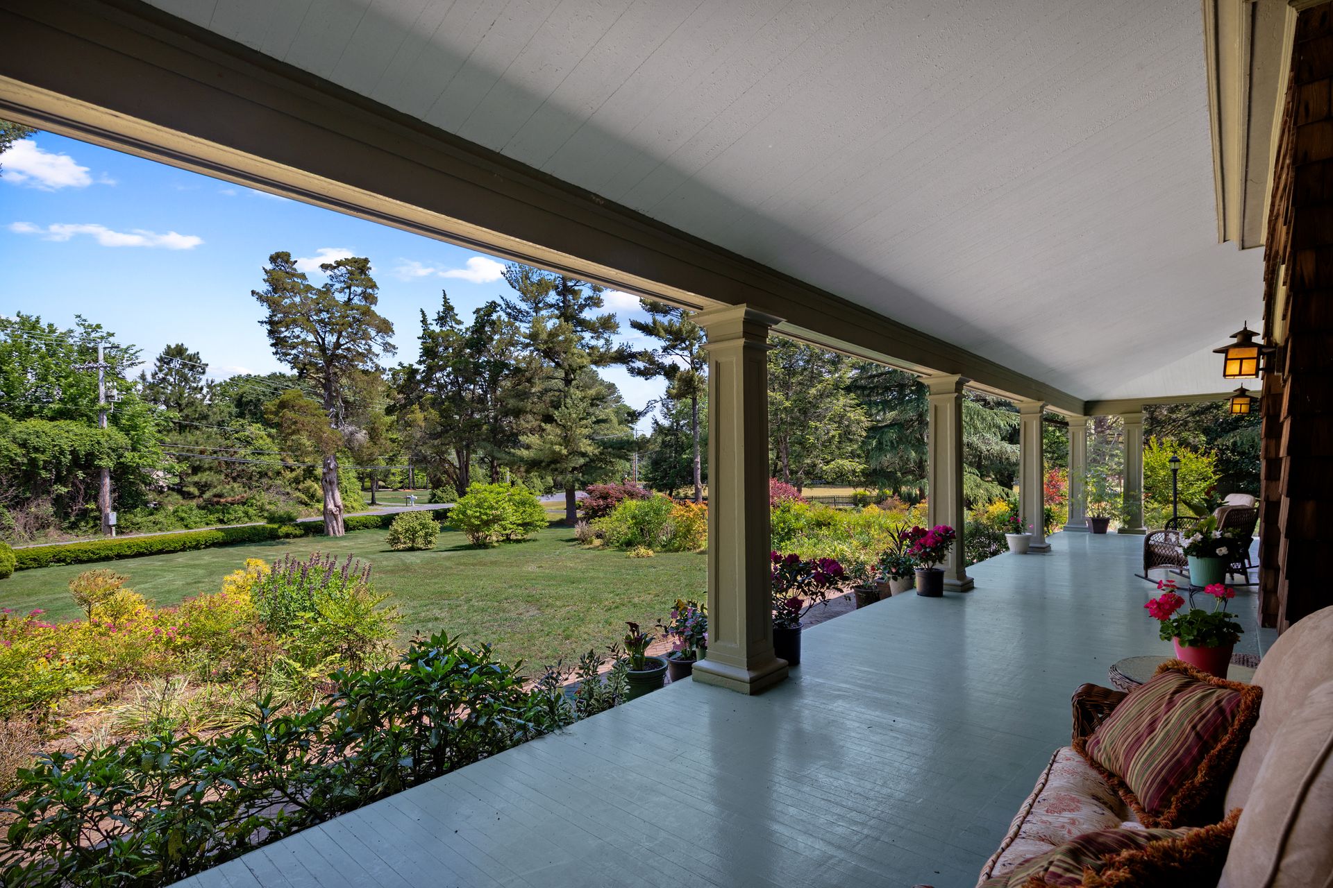 Wraparound porch overlooking gardens