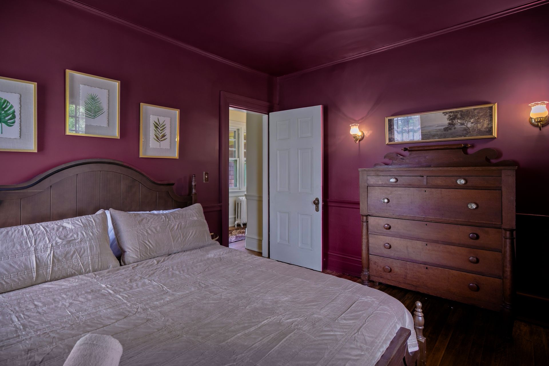 Plum bedroom with botanical prints