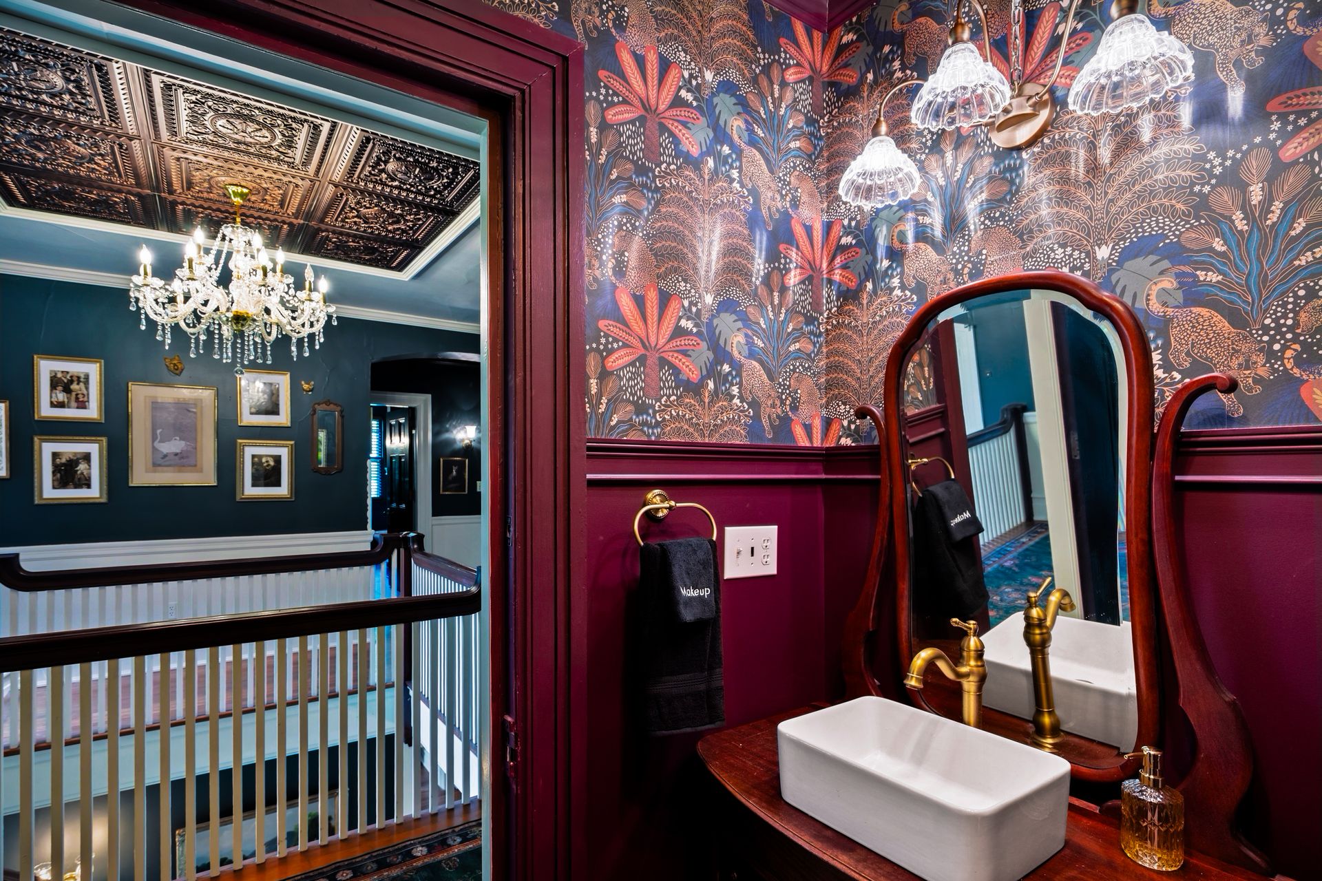 Eclectic bathroom with botanical wallpaper