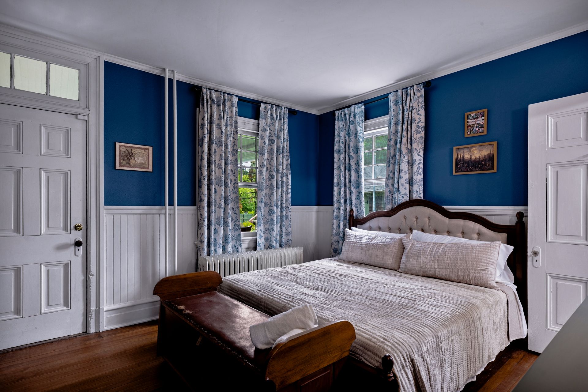 Blue bedroom with toile curtains